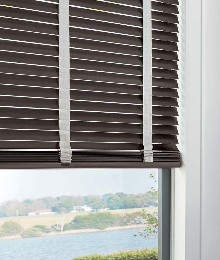 dark stain wood blinds with decorative tape detail