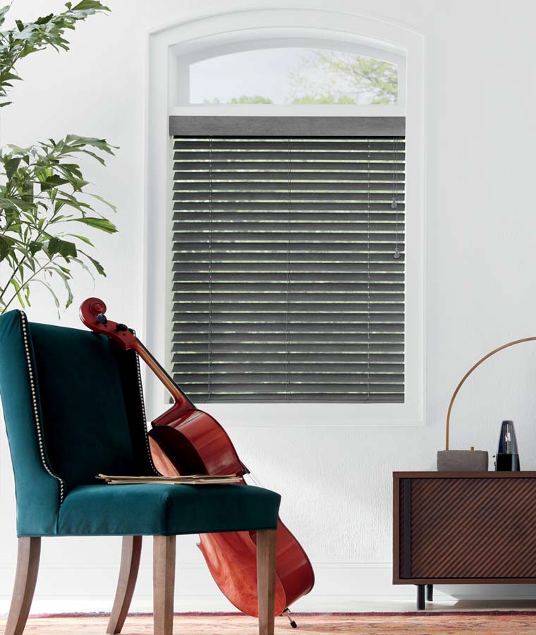 real wood blinds in dark stain in music room with cello