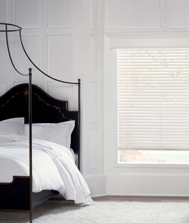 white blinds bright white bedroom with black bed frame