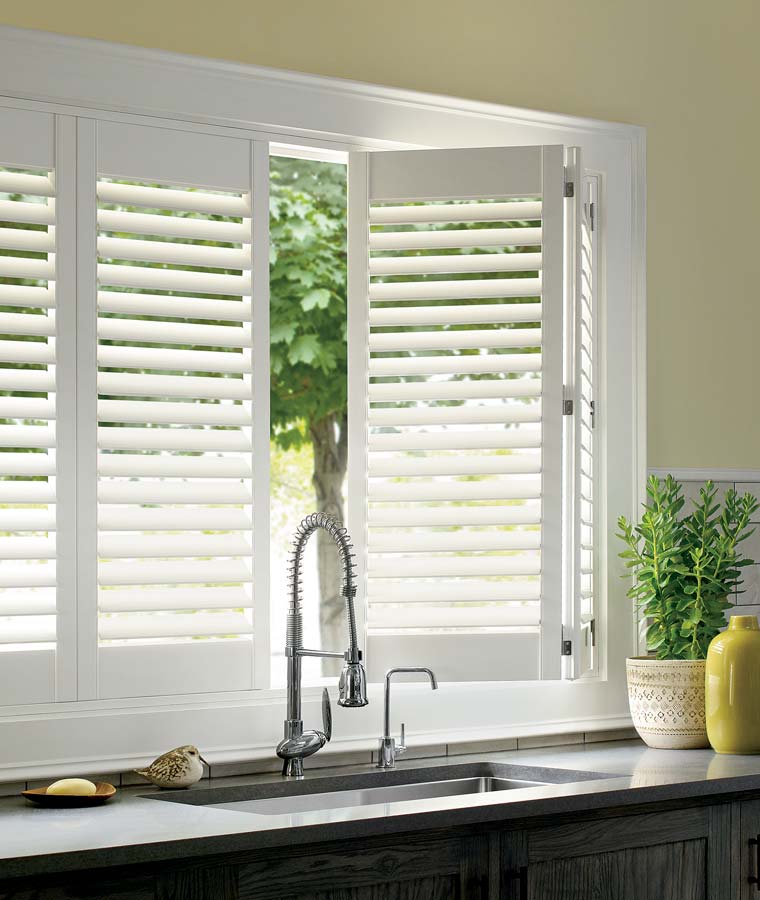 white hinged shutters over kitchen sink