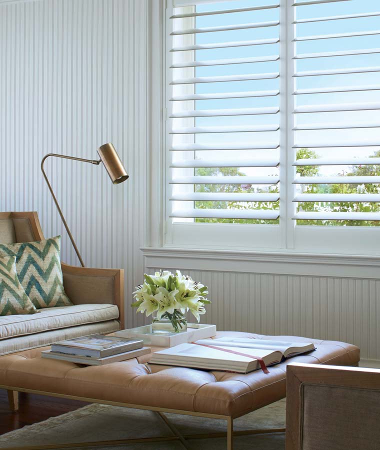 white shutters bright sitting area