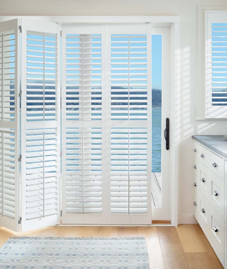 white hinged shutters for sliding glass doors coastal