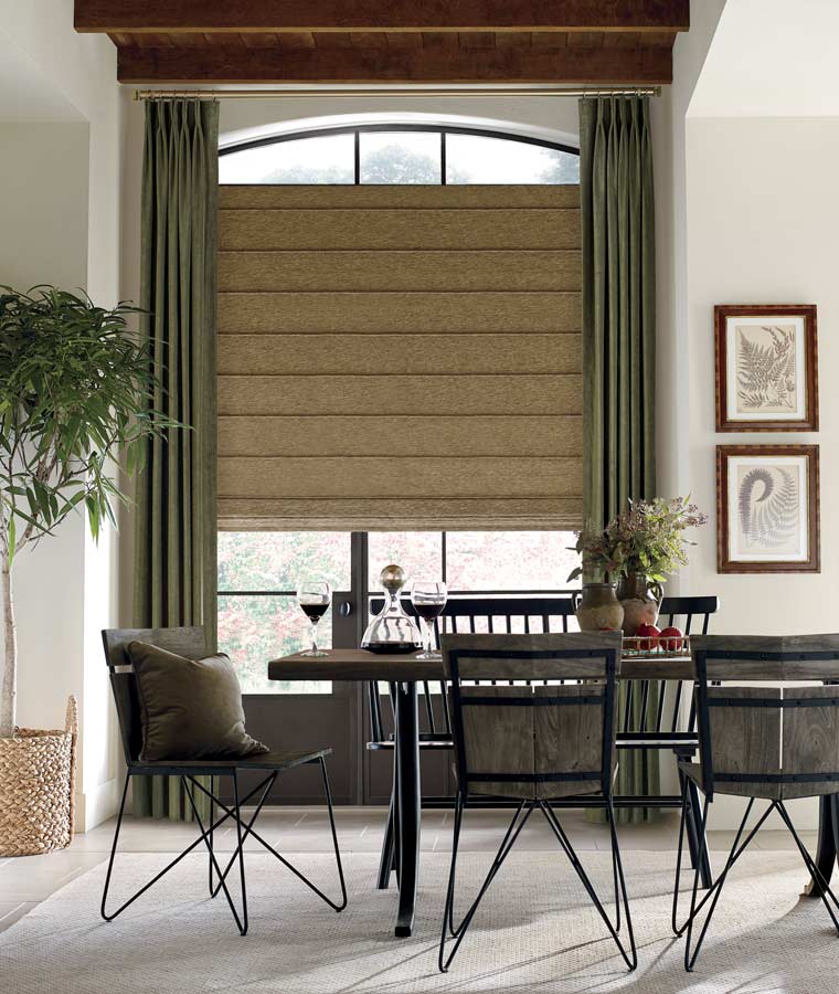 earthy roman shades and drapery in rustic dining room